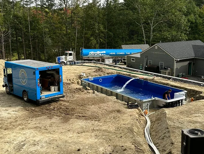 Mowry Brothers pool installation in progress, filling a new inground pool